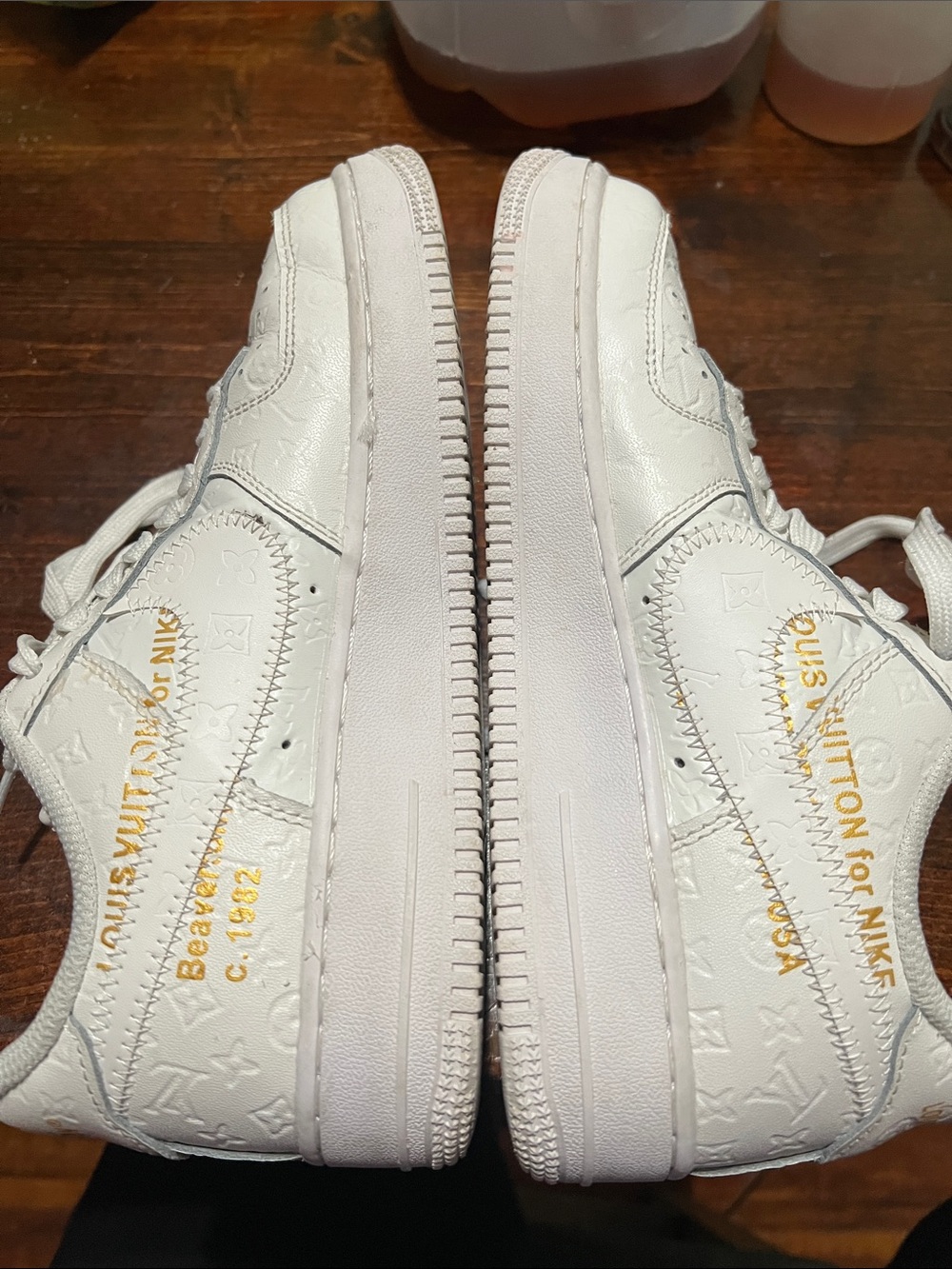 Louis Vuitton White Embossed Leather Sneakers with Gold Text